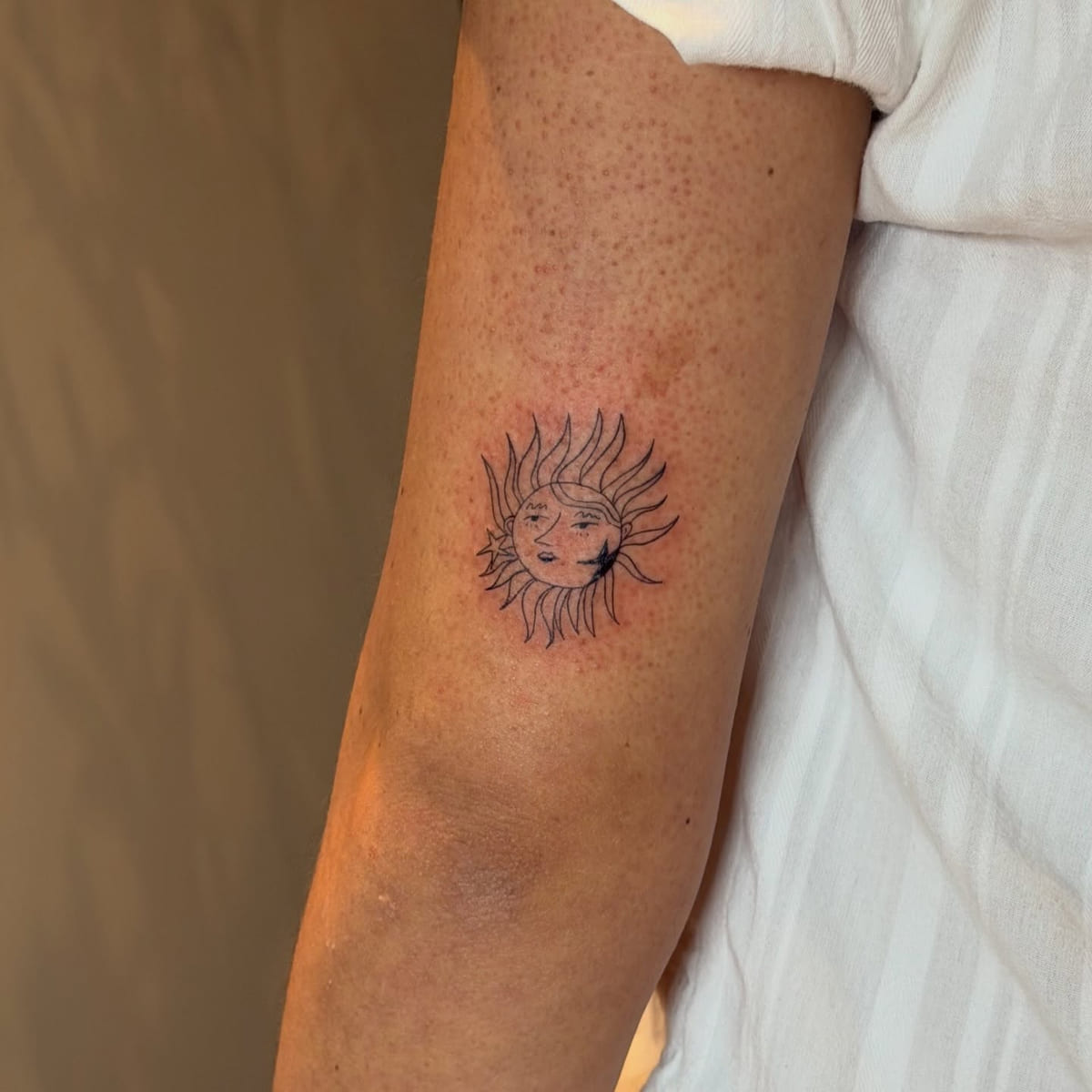 Sun with a face, star and crescent, fine line tattoo