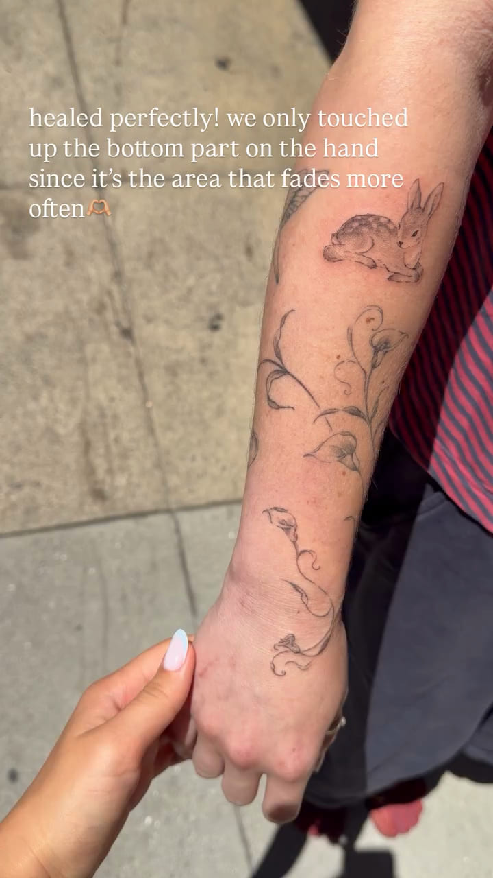 Calla lilies running from forearm onto the hand, healed fine line tattoo, healed