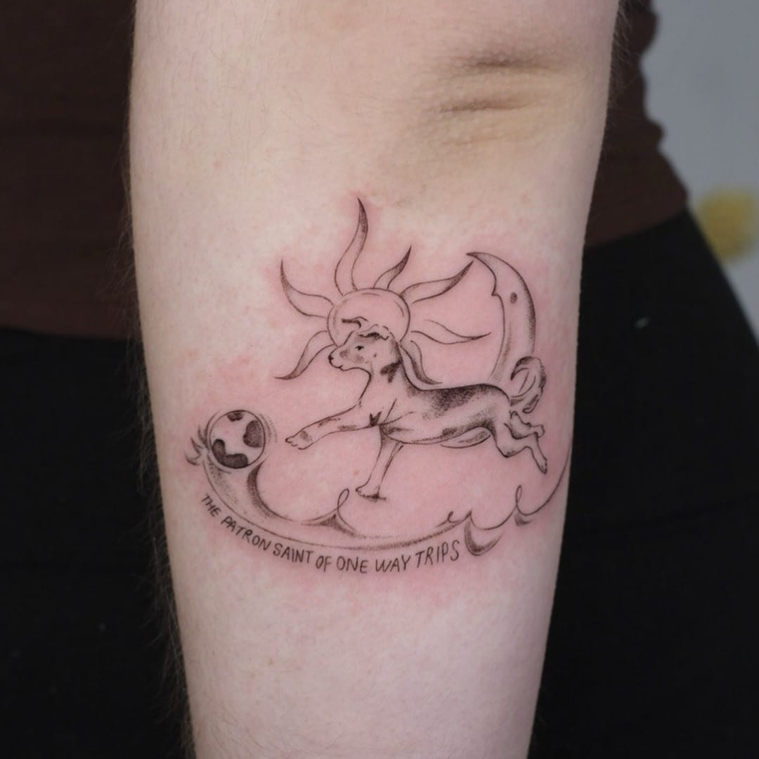 Leaping lamb with sun and moon, banner lettering below, fine line tattoo