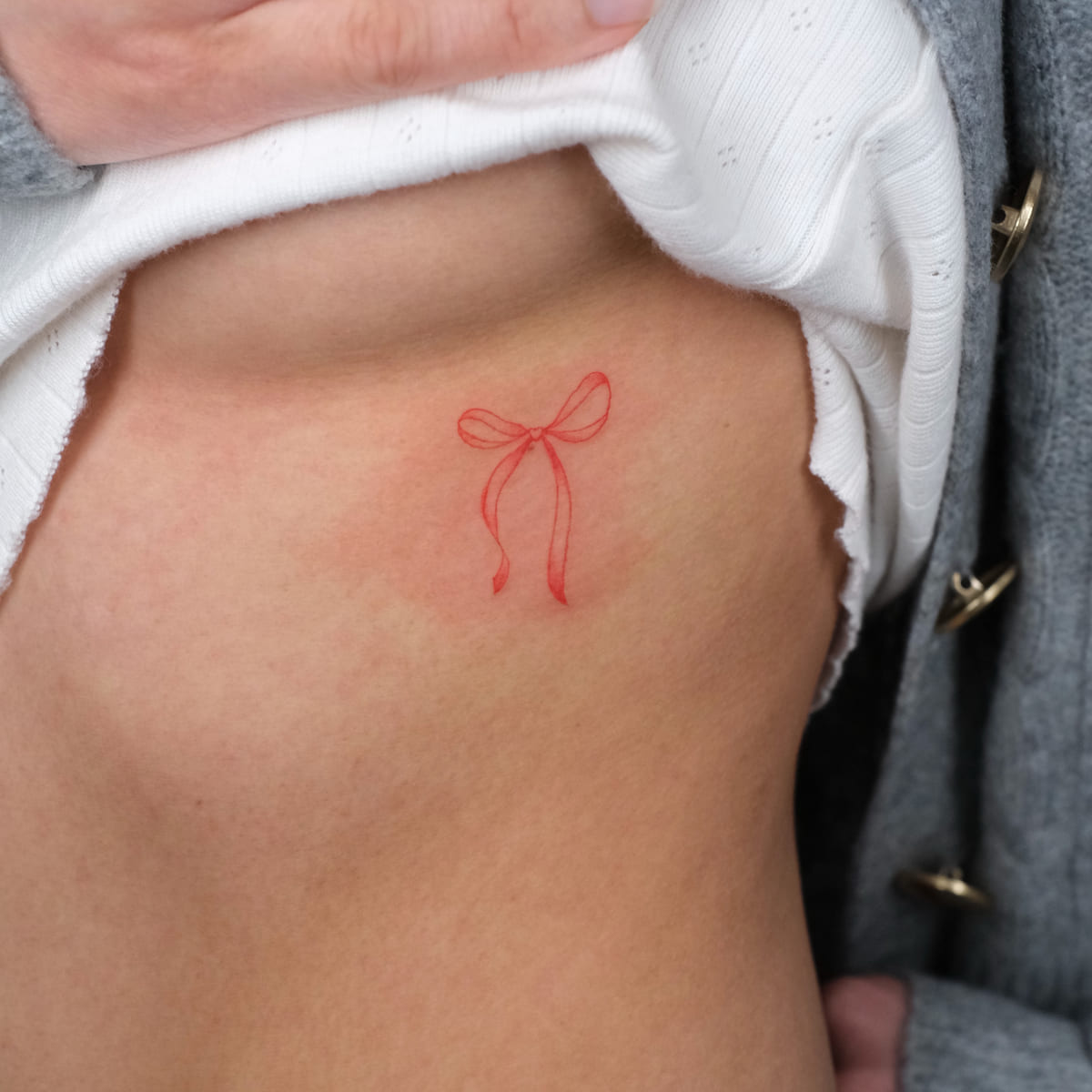 Ribbon bow, fine line tattoo