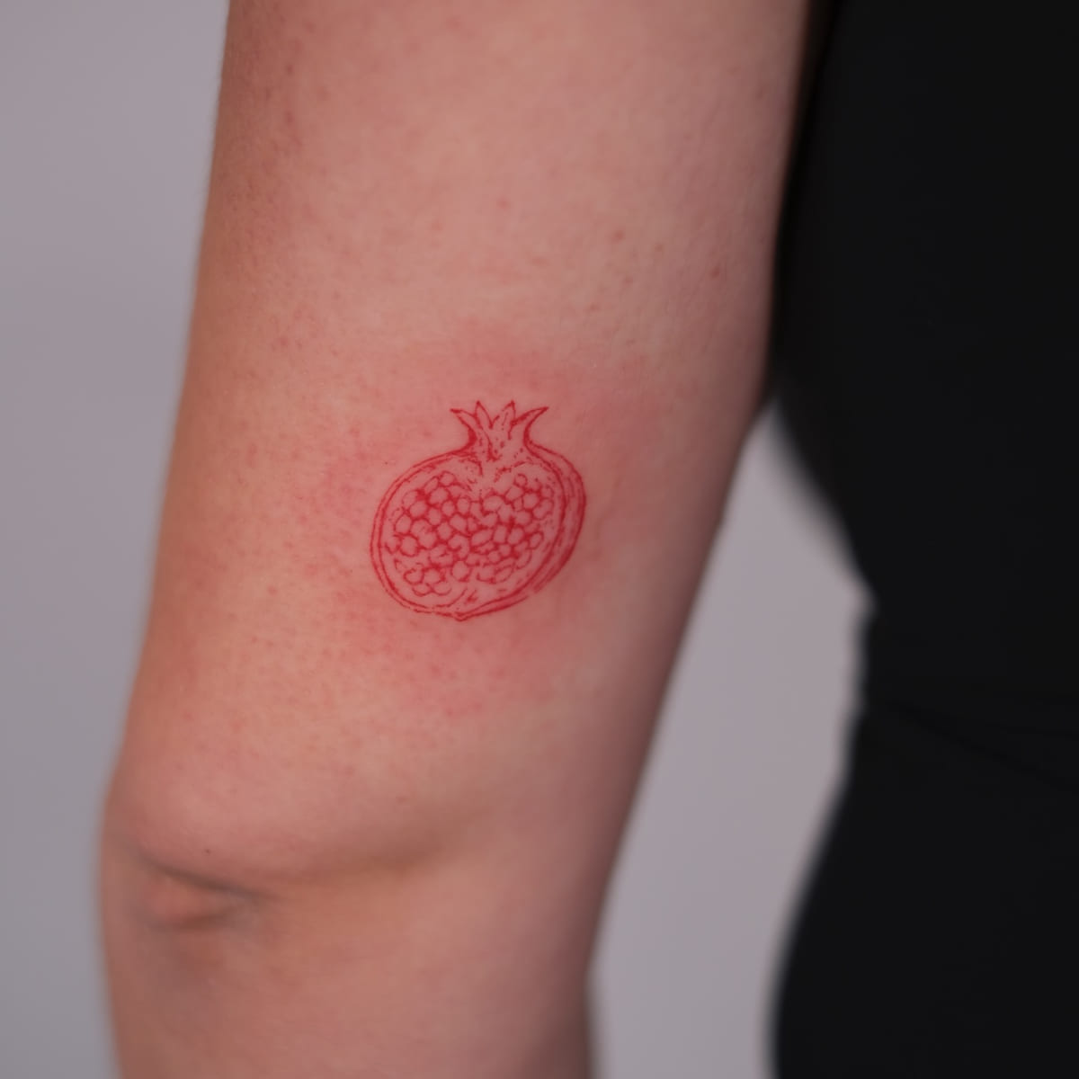 Pomegranate half in red, another view