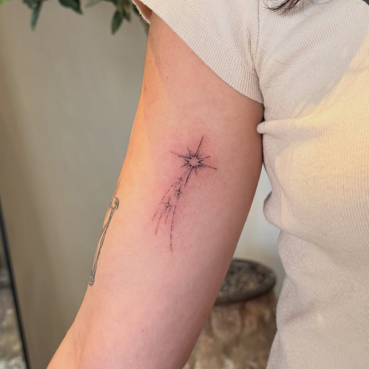 Shooting star with a sparkle trail, fine line tattoo