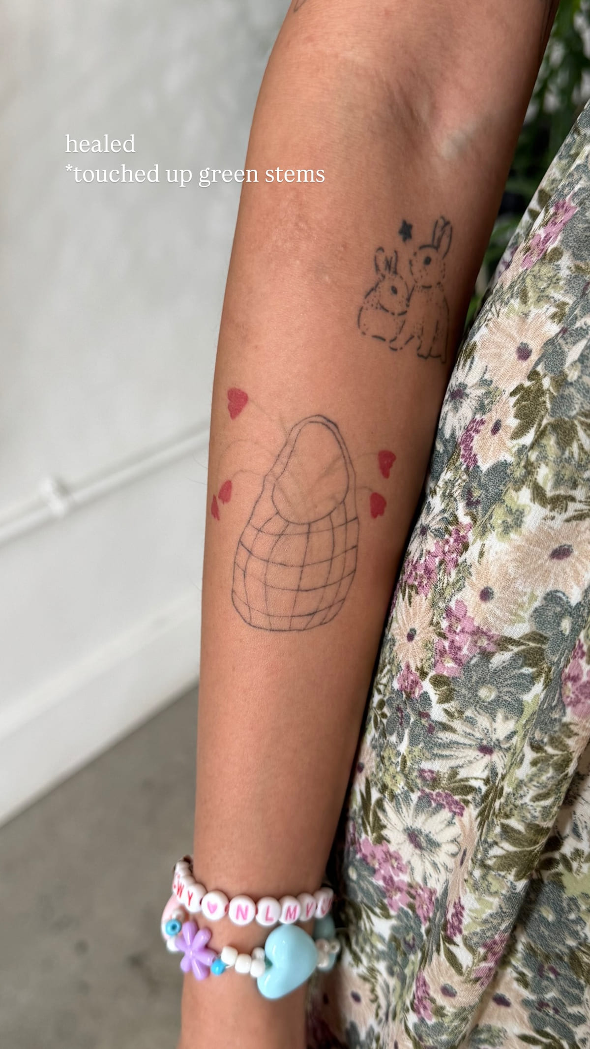 Rabbit with a basket, healed fine line tattoo