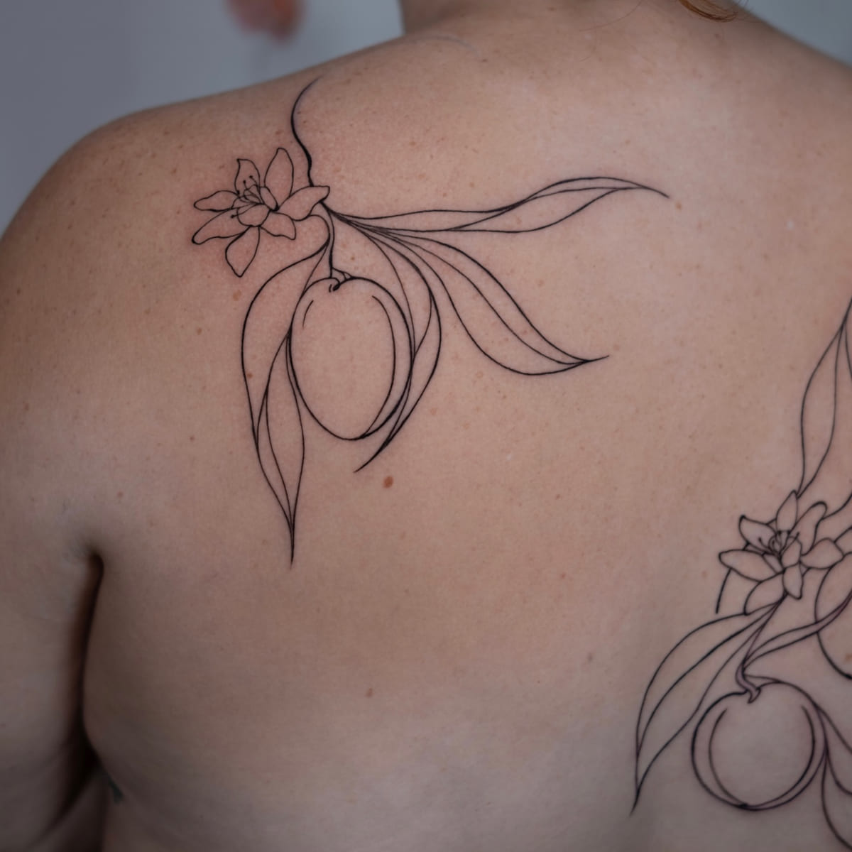 Back piece: citrus branches with blossoms in single line, fine line tattoo