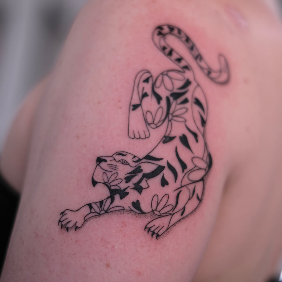 Prowling tiger filled with leaves, another view