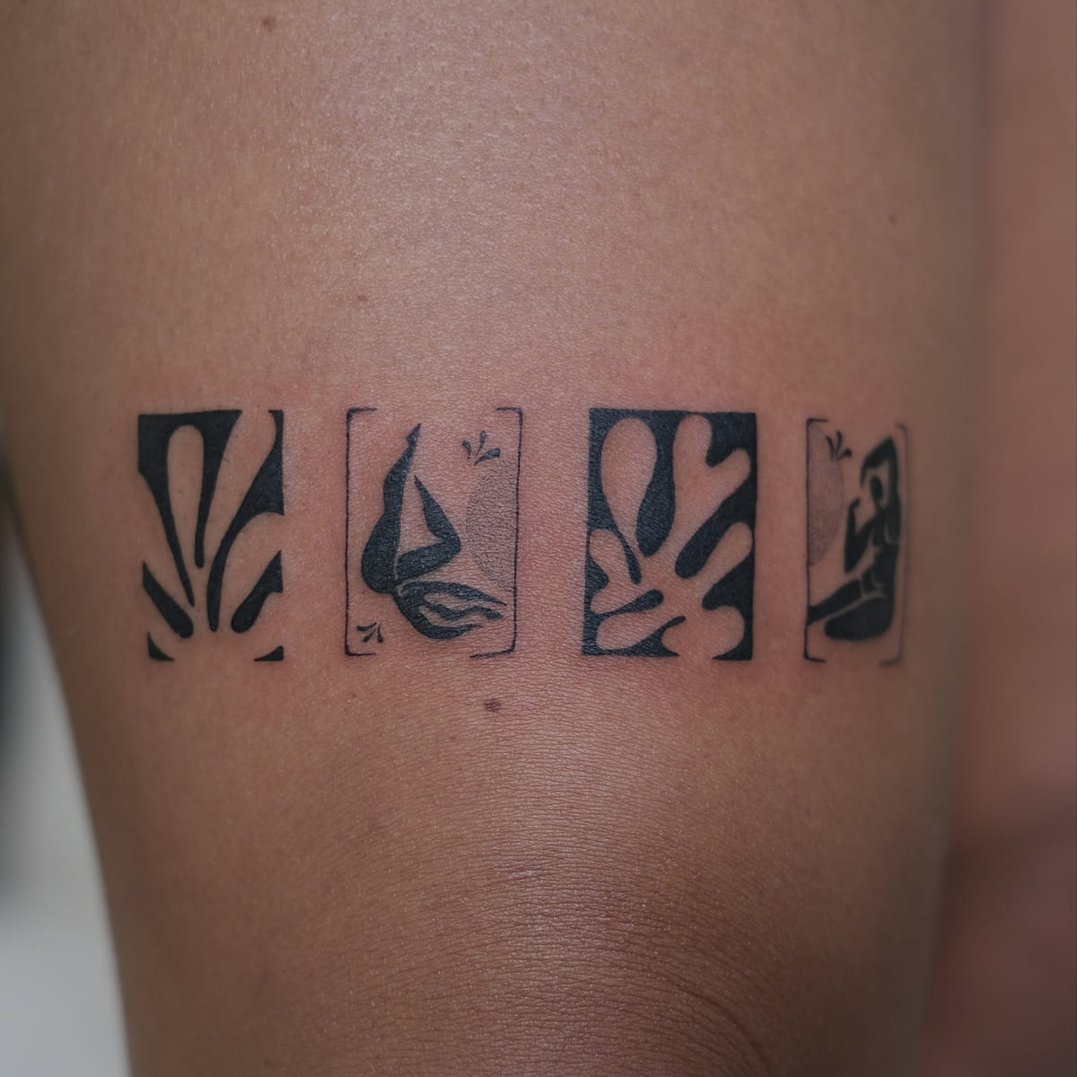 Matisse cut out band above the knee, healed fine line tattoo, the day it was made