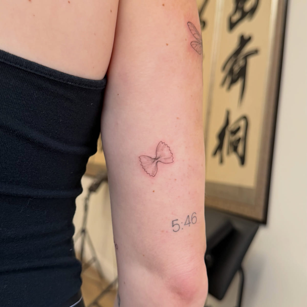 Fine line bow, fine line tattoo