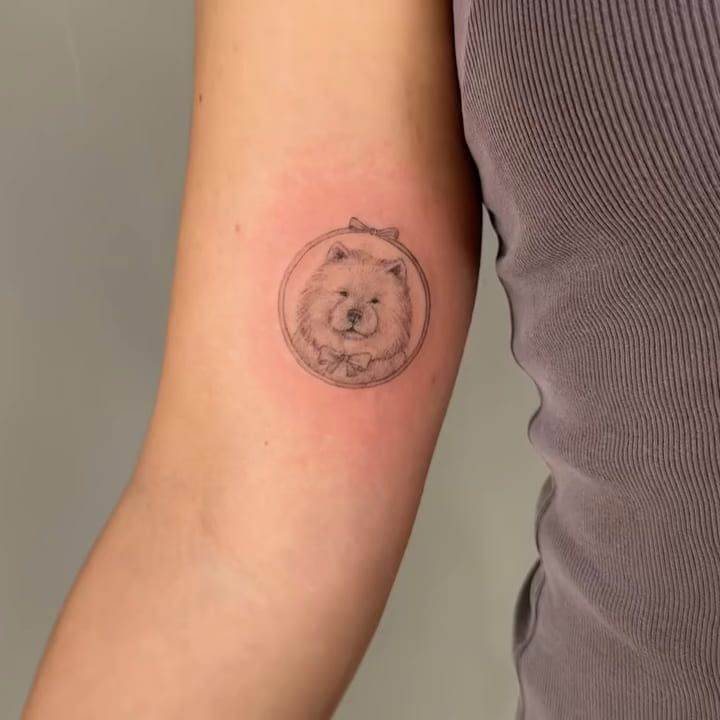 Chow chow portrait in a round frame with bows, fine line tattoo