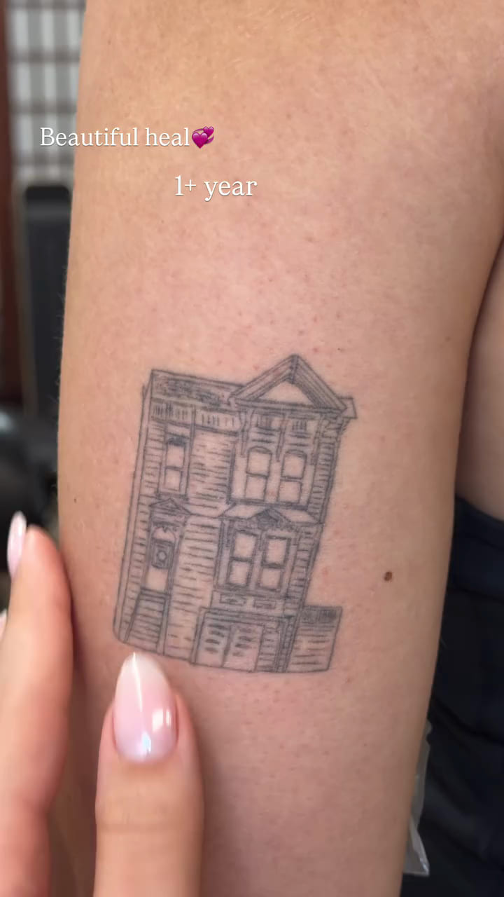 Victorian house facade on a forearm, healed fine line tattoo, healed
