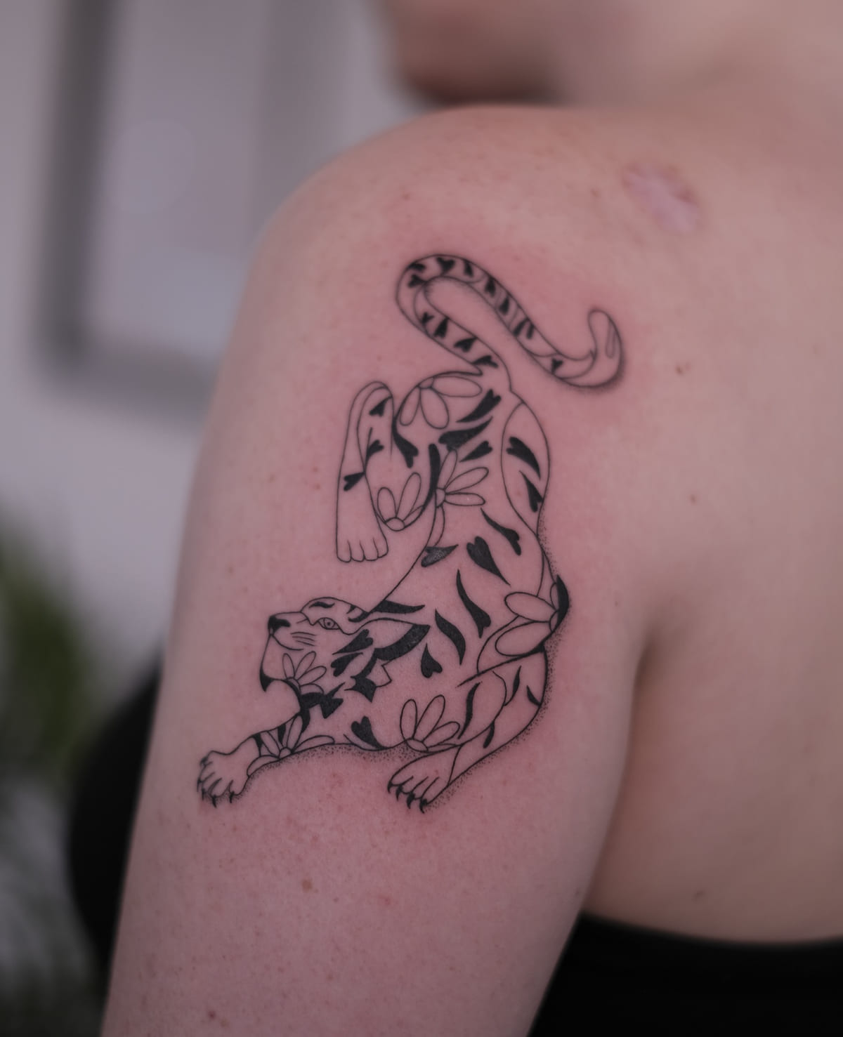 Prowling tiger filled with leaves, another view