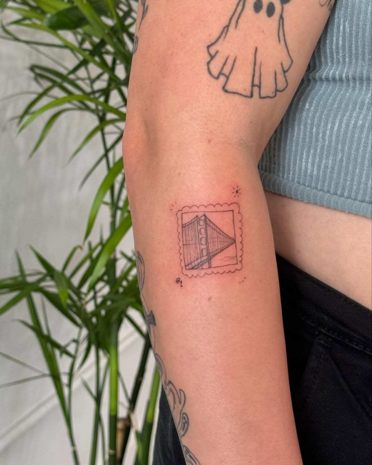 Postage stamp with the Golden Gate Bridge, fine line tattoo