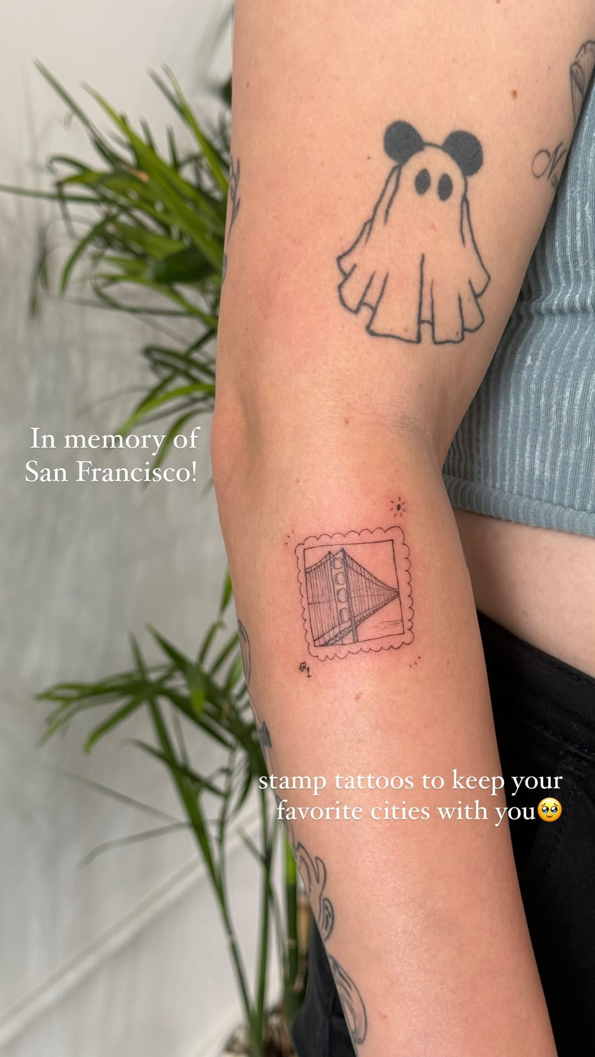 Golden Gate Bridge stamp on a forearm, fine line tattoo