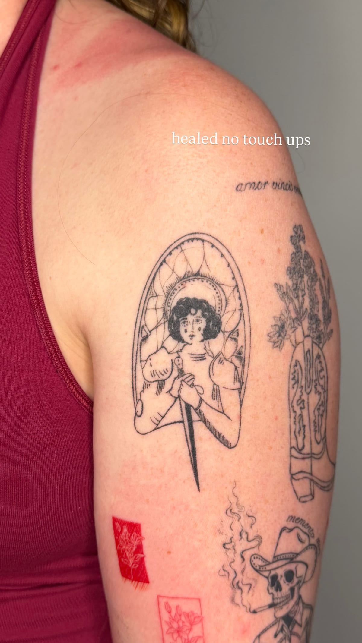 Woman with a dagger in an arched frame, healed fine line tattoo, healed