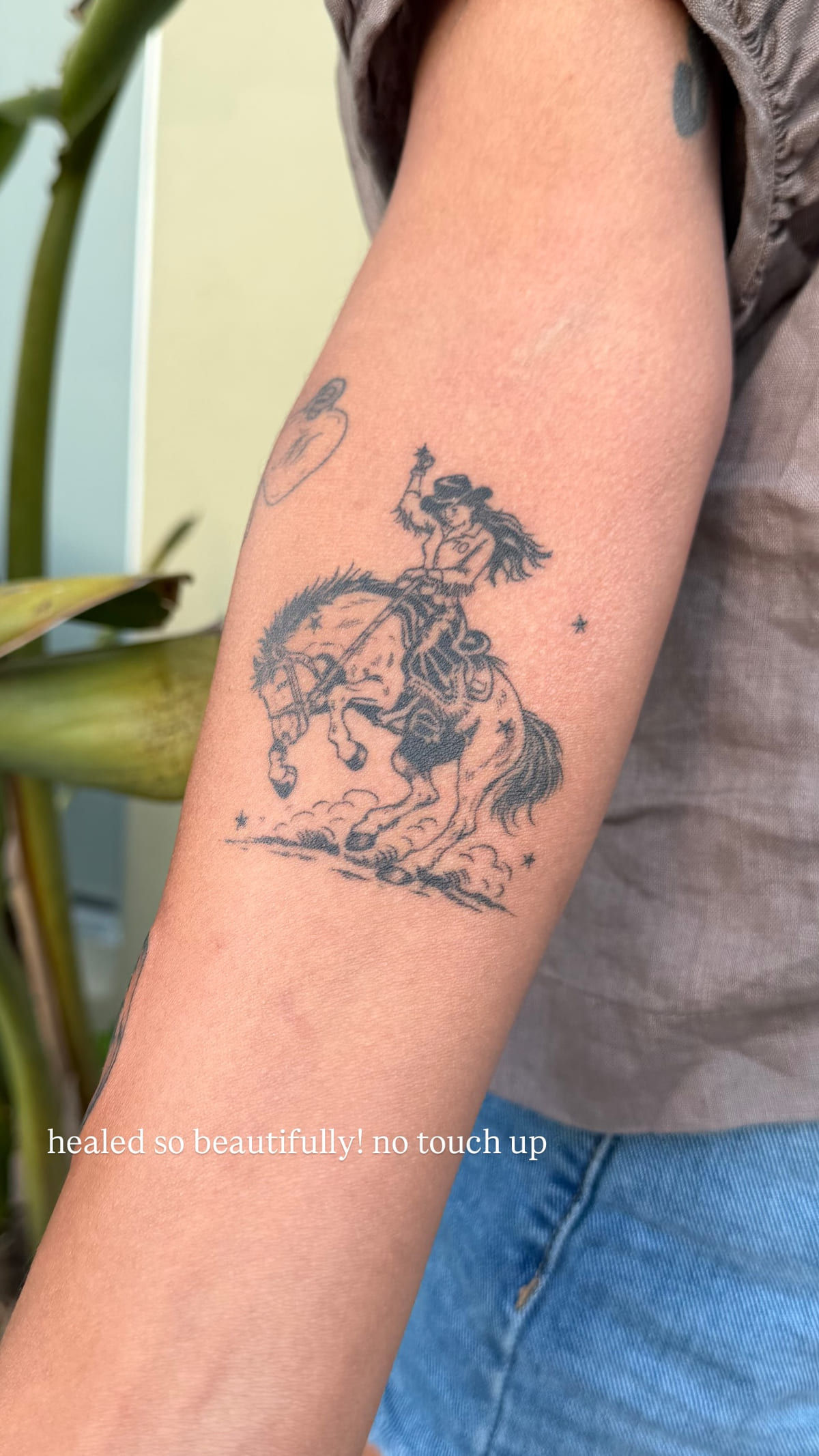 Cowgirl on a rearing horse, healed fine line tattoo, healed