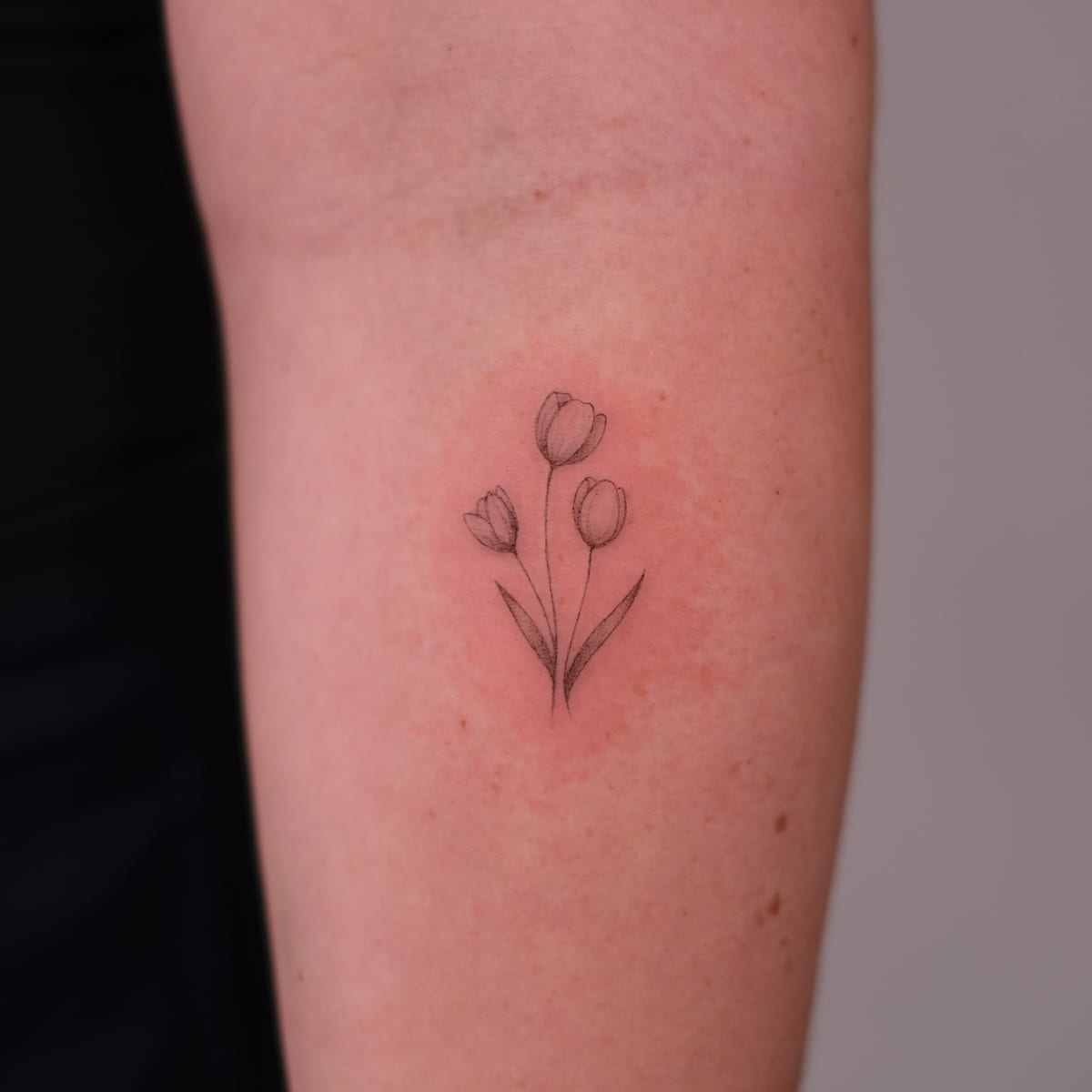 Three tulips, fine line tattoo
