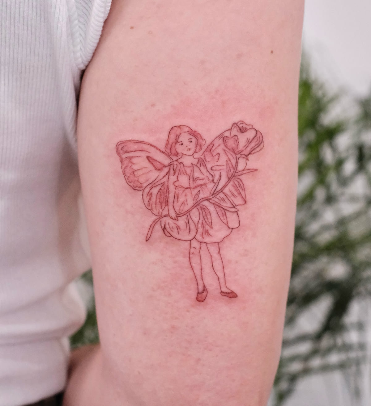 Flower fairy with forget me nots, after the classic illustration, fine line tattoo