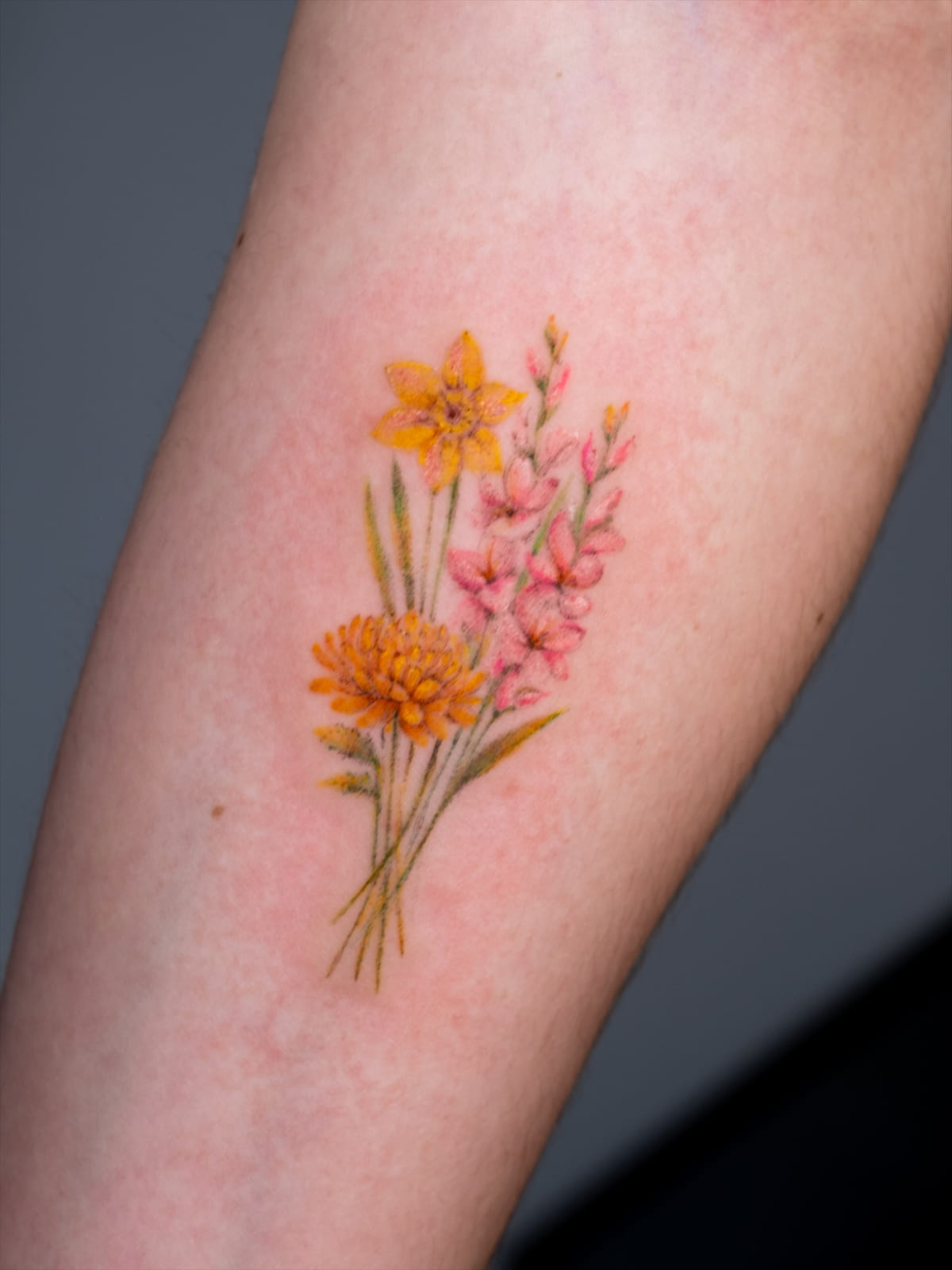 Birth flower bouquet in color: marigold, daffodil, pink larkspur, another view