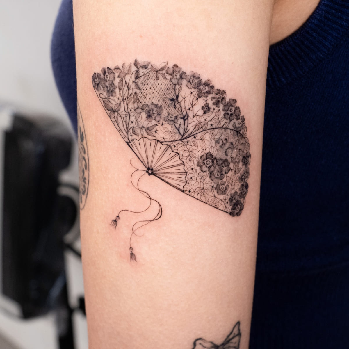 Lace hand fan with flowers and a tassel, another view