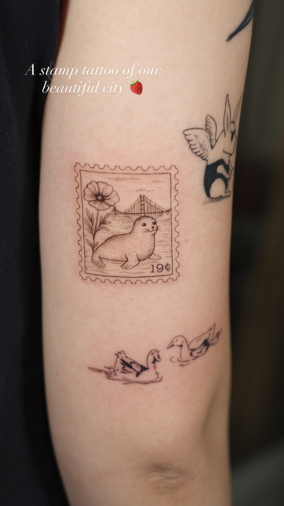 Postage stamp with a seal and the Golden Gate Bridge, fine line tattoo