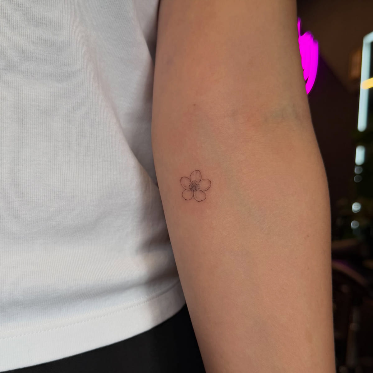 Tiny five petal flower outline, fine line tattoo