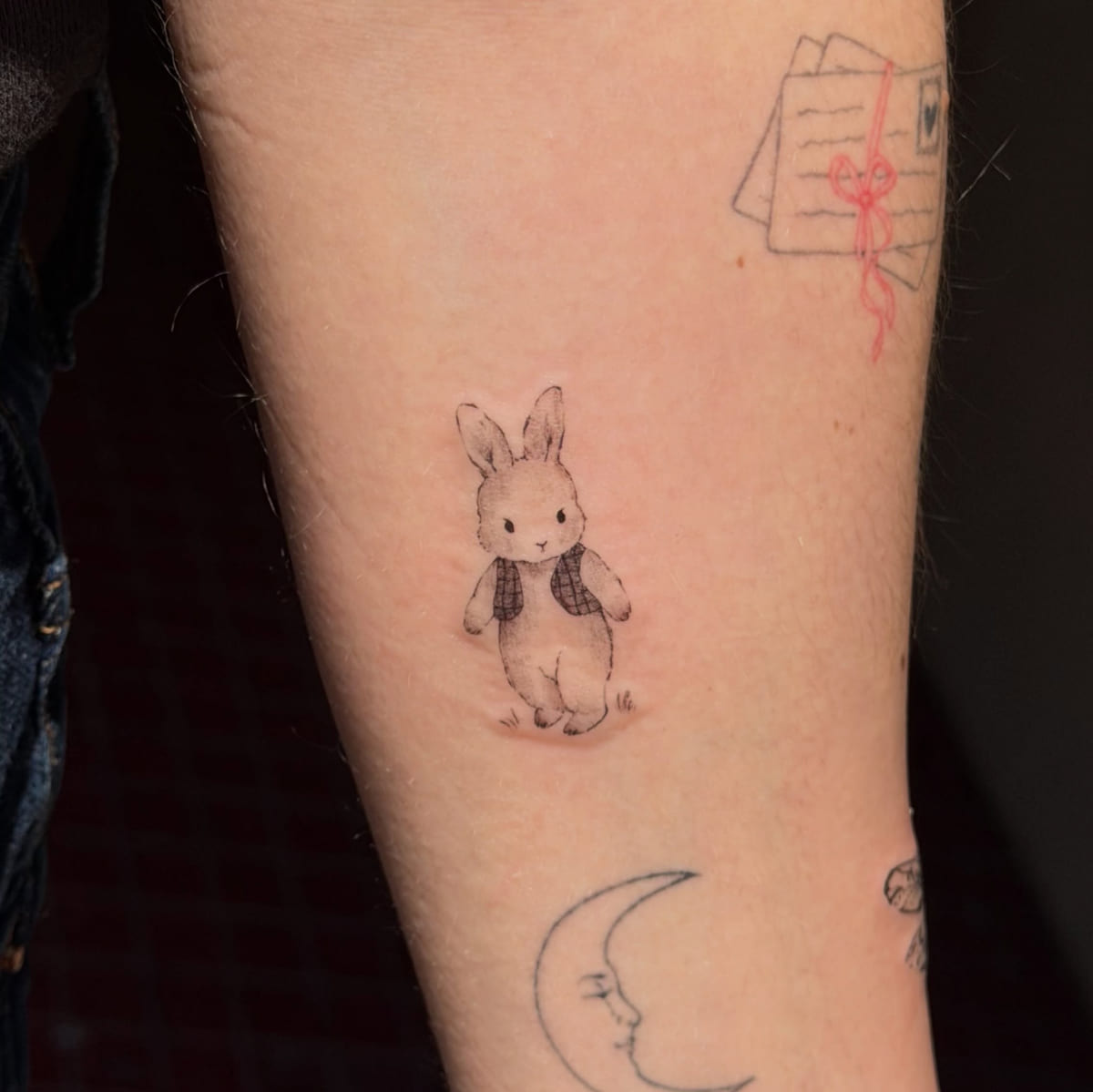 Storybook bunny in a vest, fine line tattoo