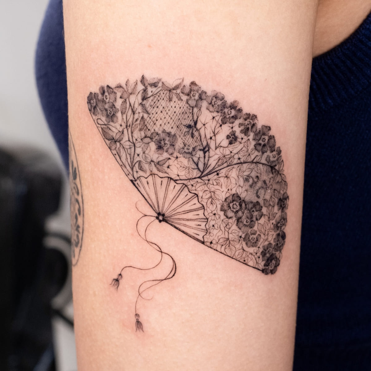 Lace hand fan with flowers and a tassel, another view
