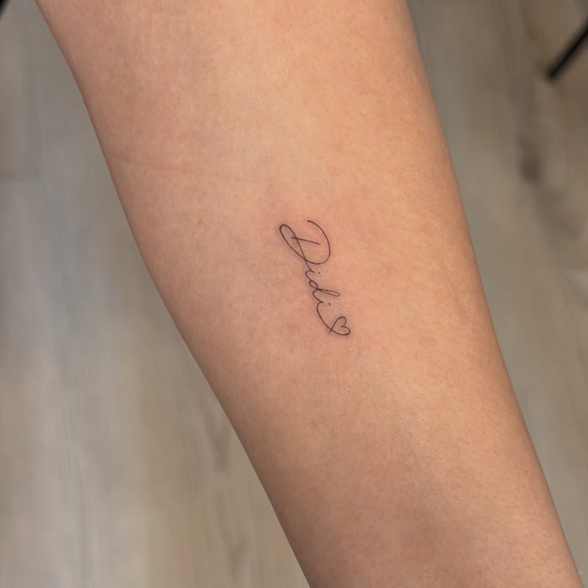 Script word: Dad with a heart, fine line tattoo