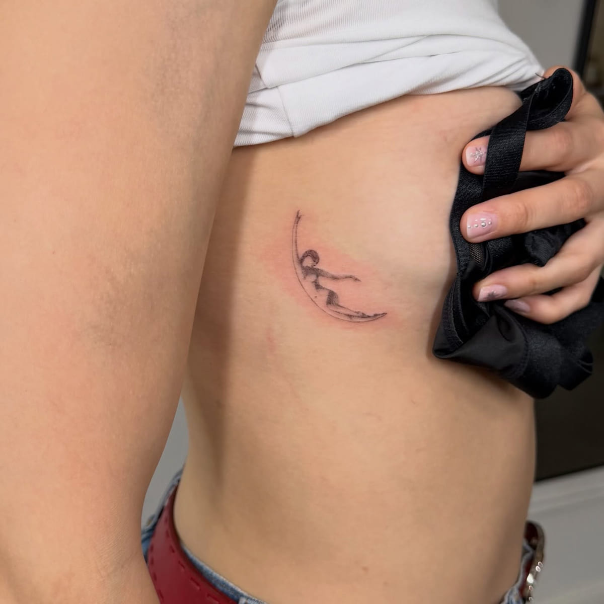 Crescent moon holding a small landscape, another view