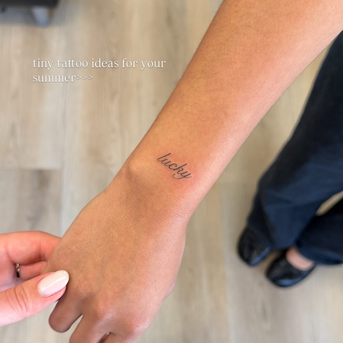 Script word: lucky, fine line tattoo