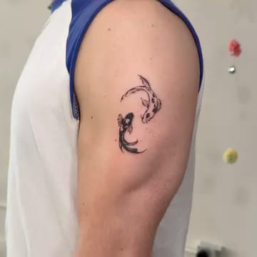 Two koi circling, fine line tattoo