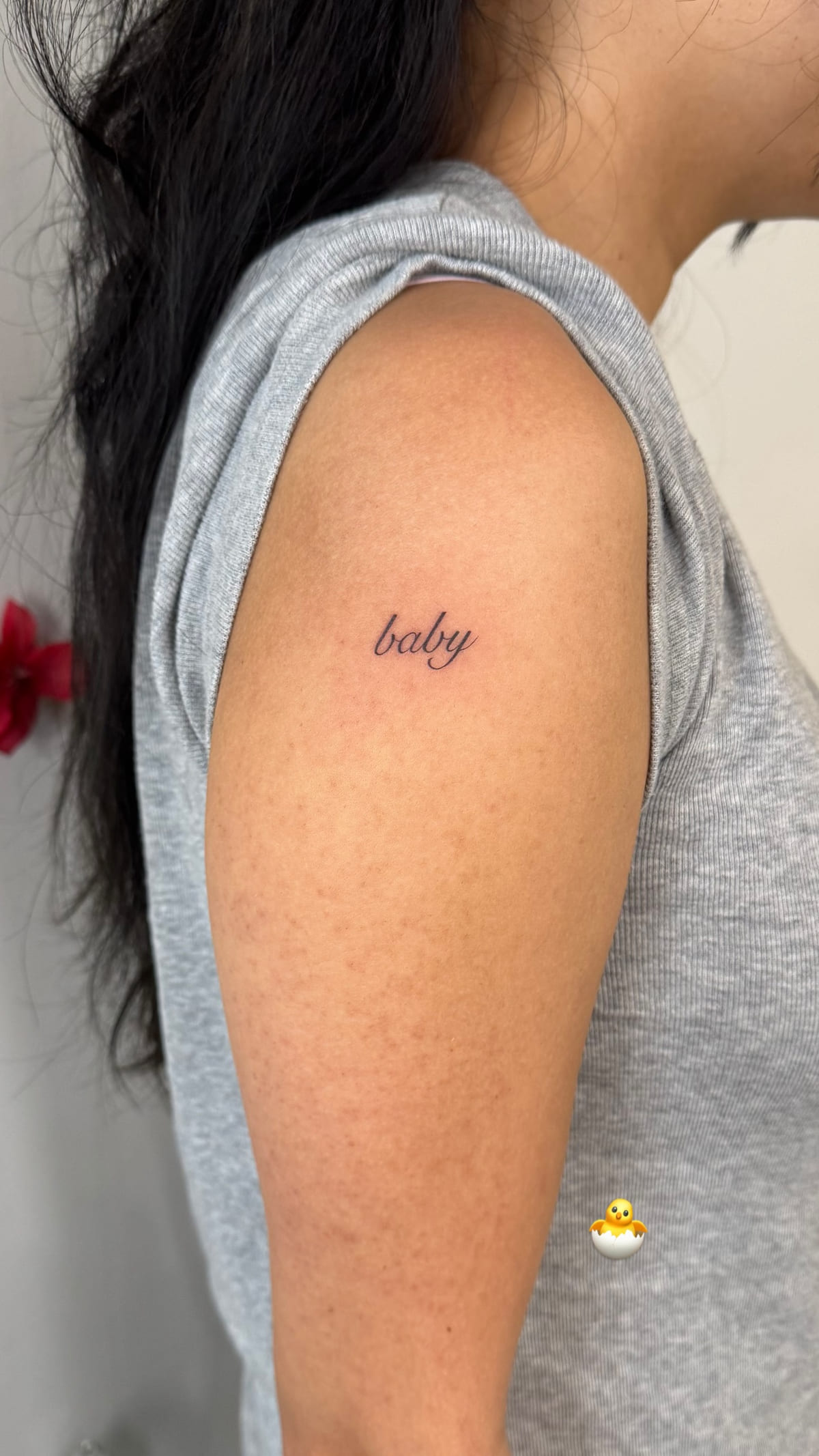 The word baby in fine script, healed fine line tattoo, the day it was made