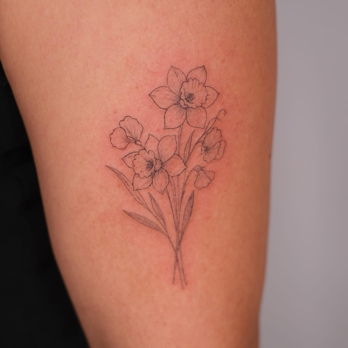 Daffodil bouquet, fine line tattoo