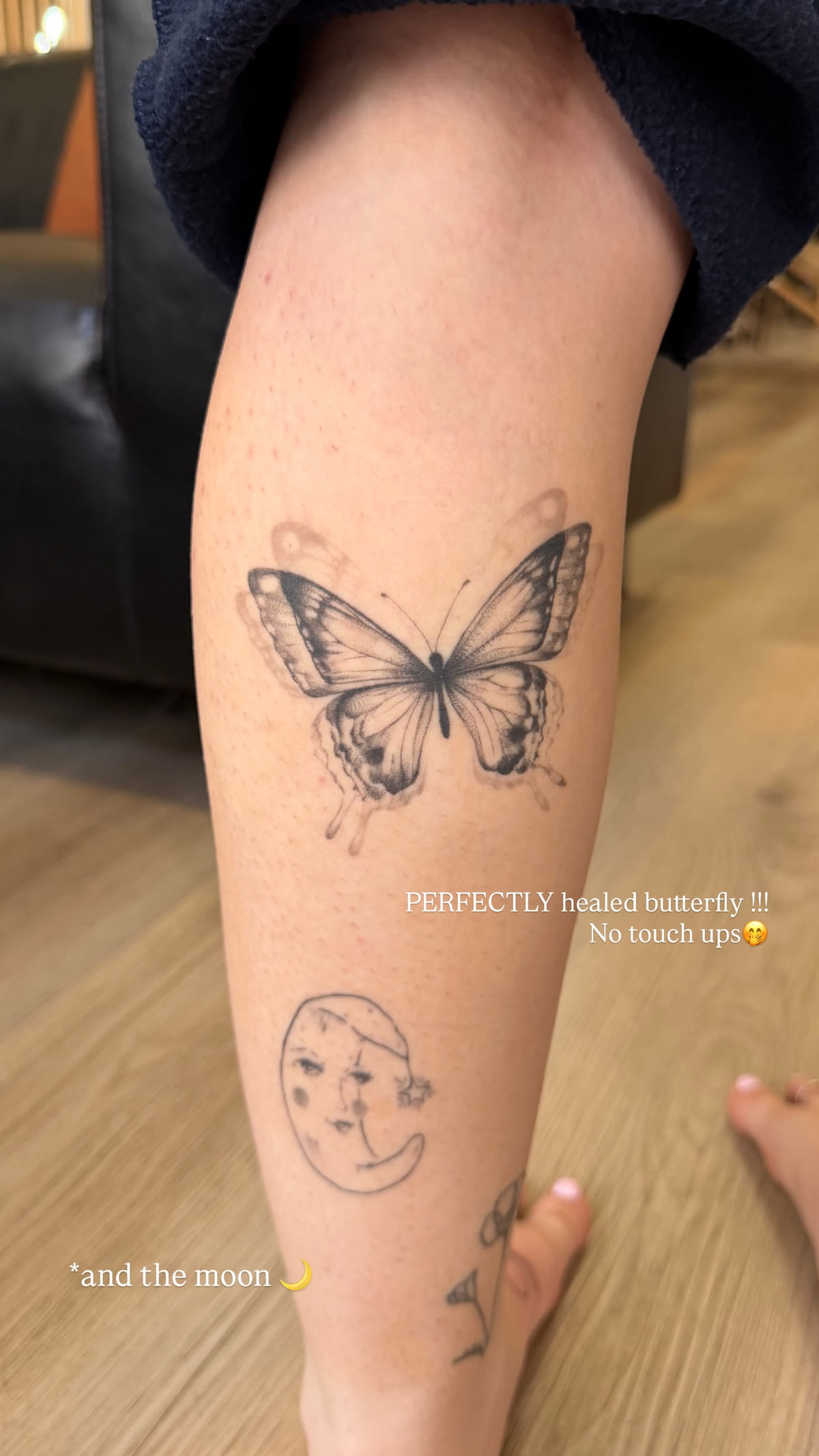 Shaded butterfly and the moon with a face, healed fine line tattoo, healed