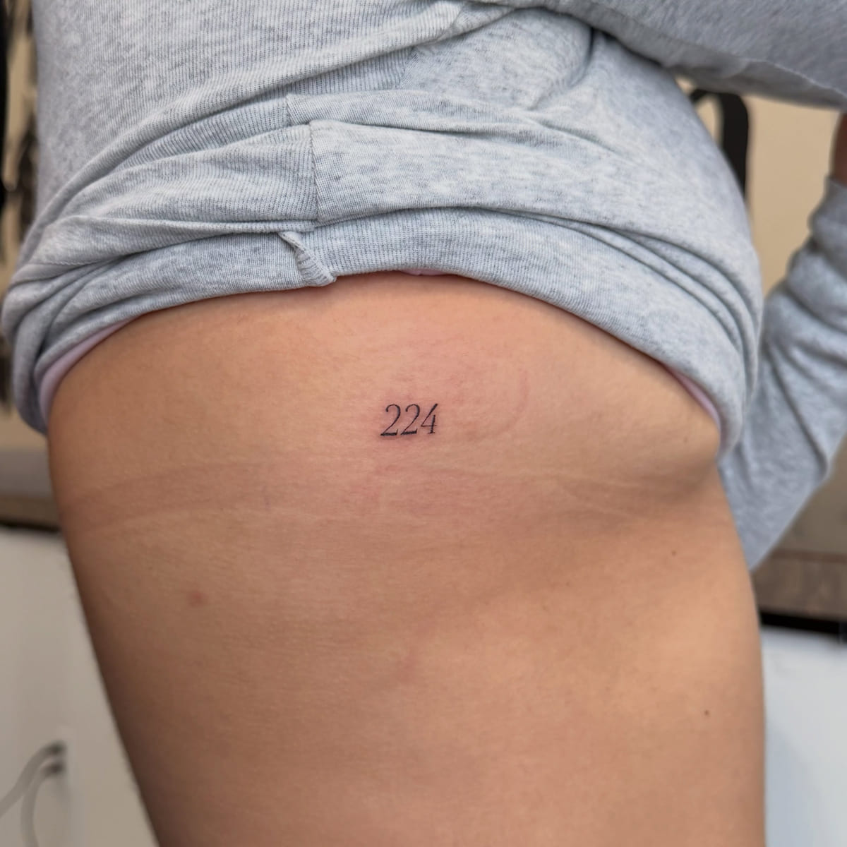 Numerals 224, fine line tattoo