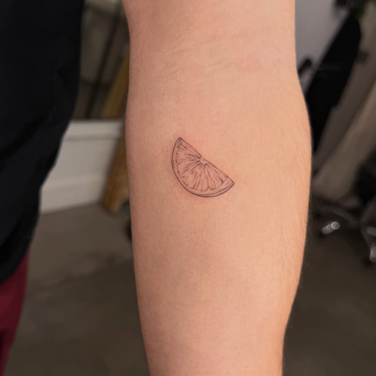 Citrus slice outline, fine line tattoo
