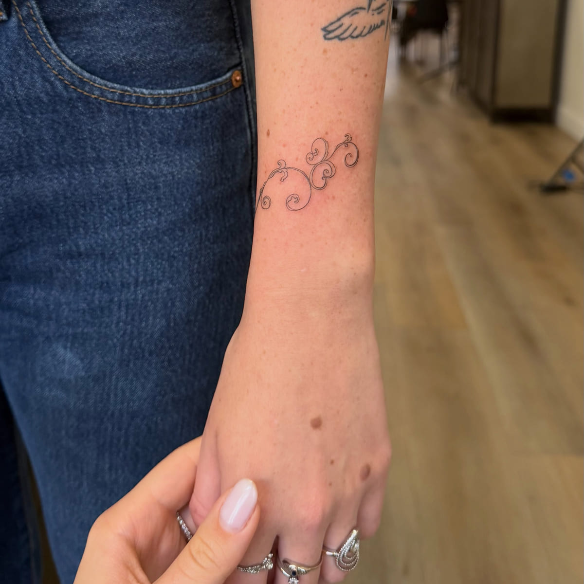 Swirl ornament, fine line tattoo