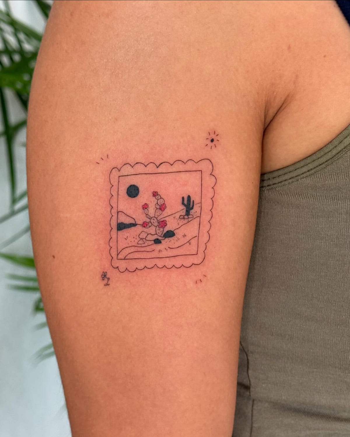 Postage stamp of a desert with cactus and red flowers, fine line tattoo