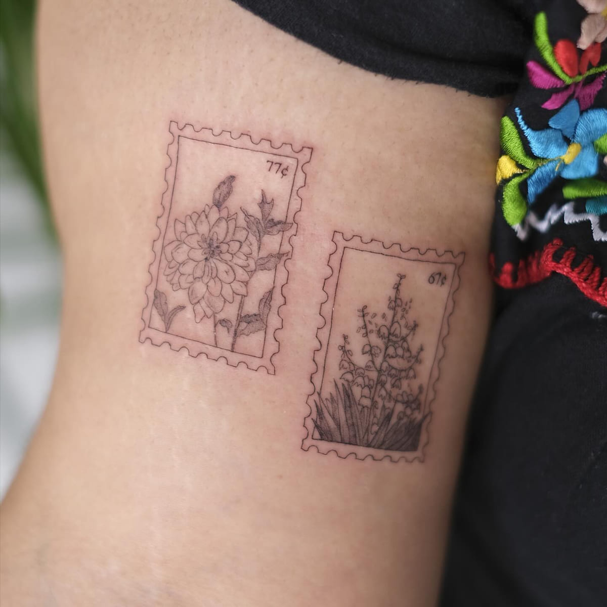 Two botanical postage stamps side by side, fine line tattoo