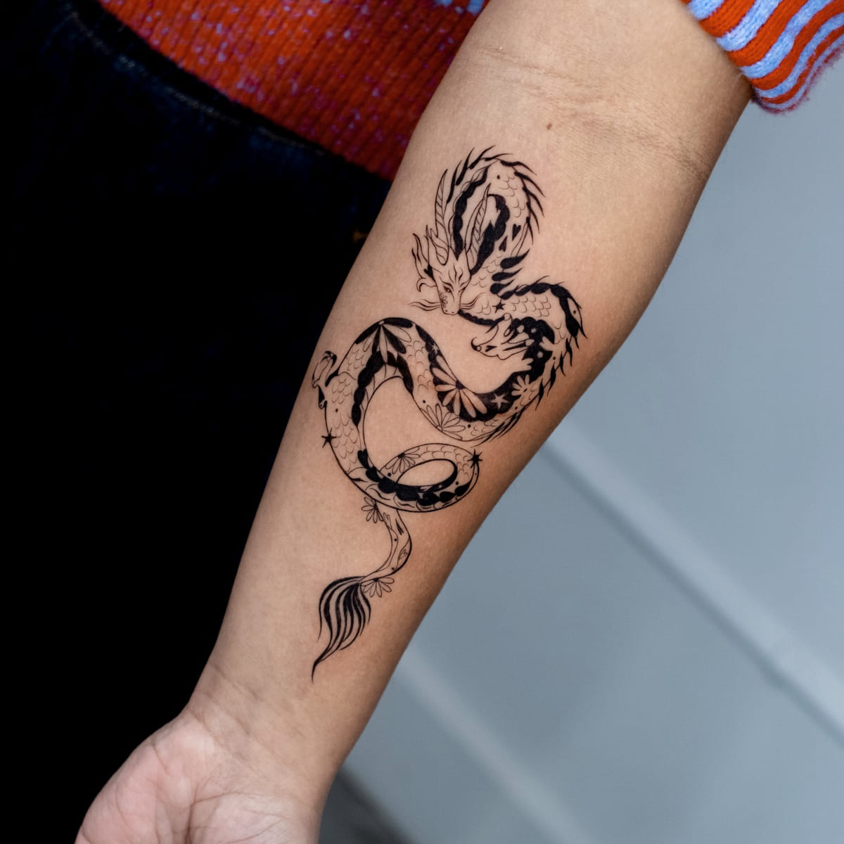 Coiled dragon with patterned body, another view