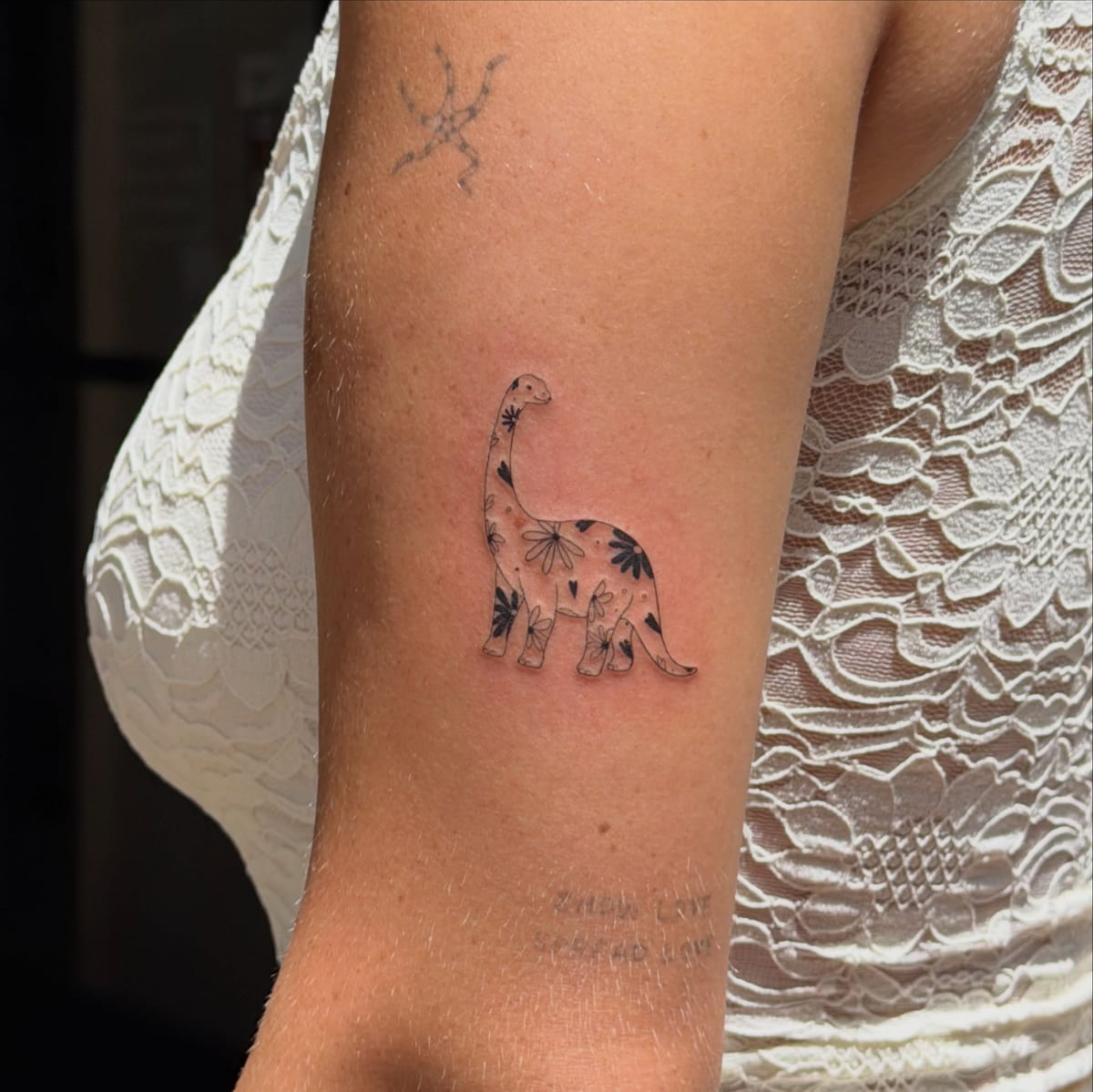 Brontosaurus filled with flowers, fine line tattoo