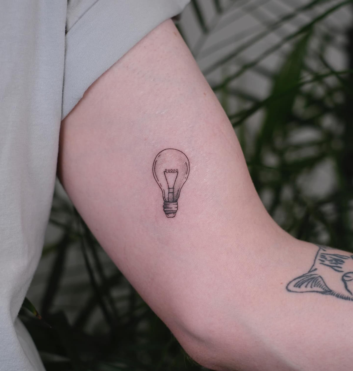Light bulb, micro realism, fine line tattoo