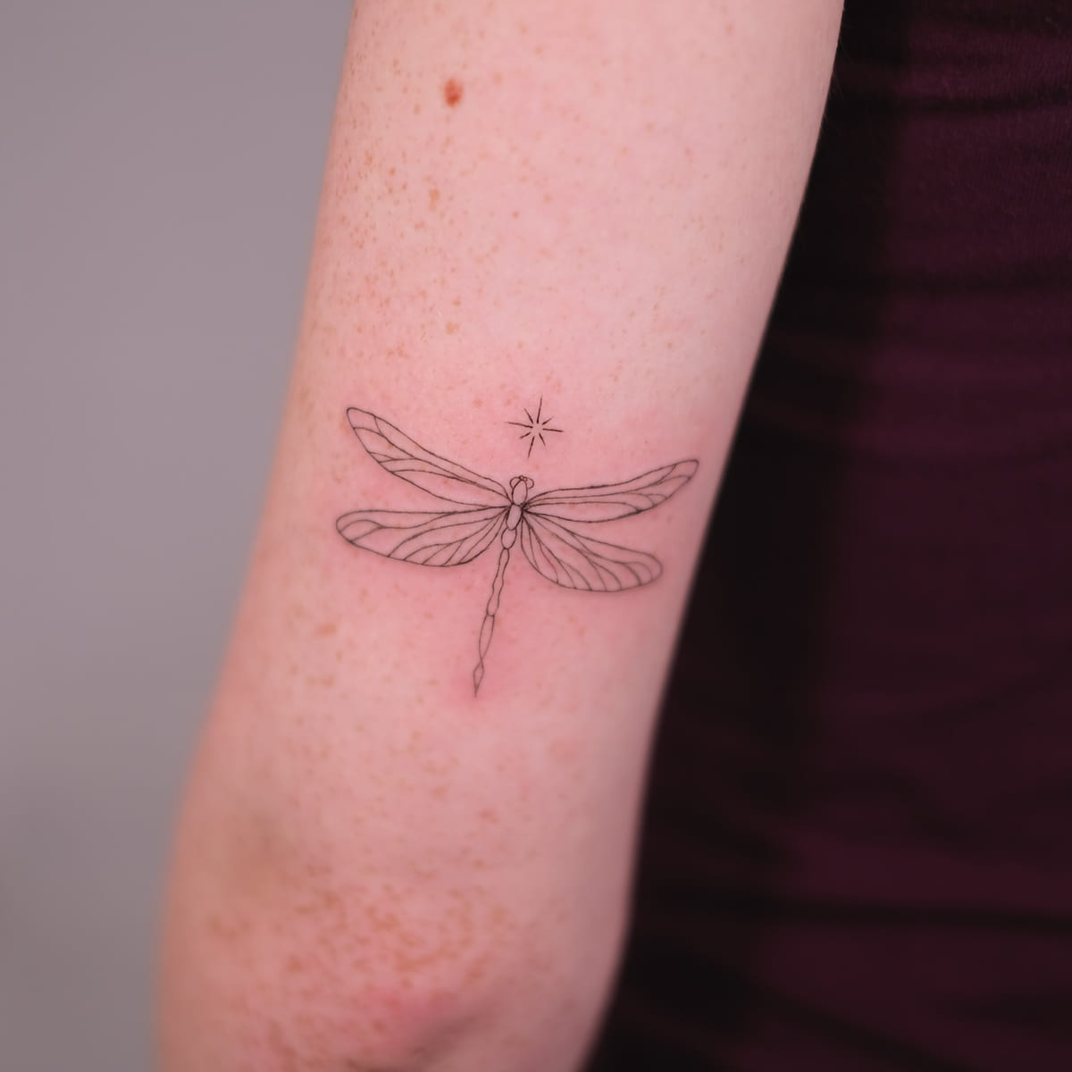 Dragonfly with a sparkle, fine line tattoo