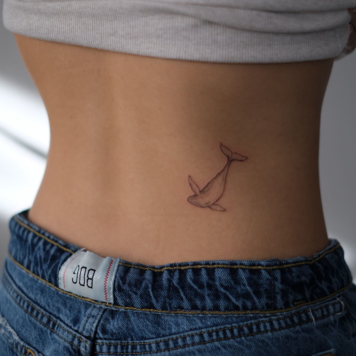 Small whale, fine line tattoo