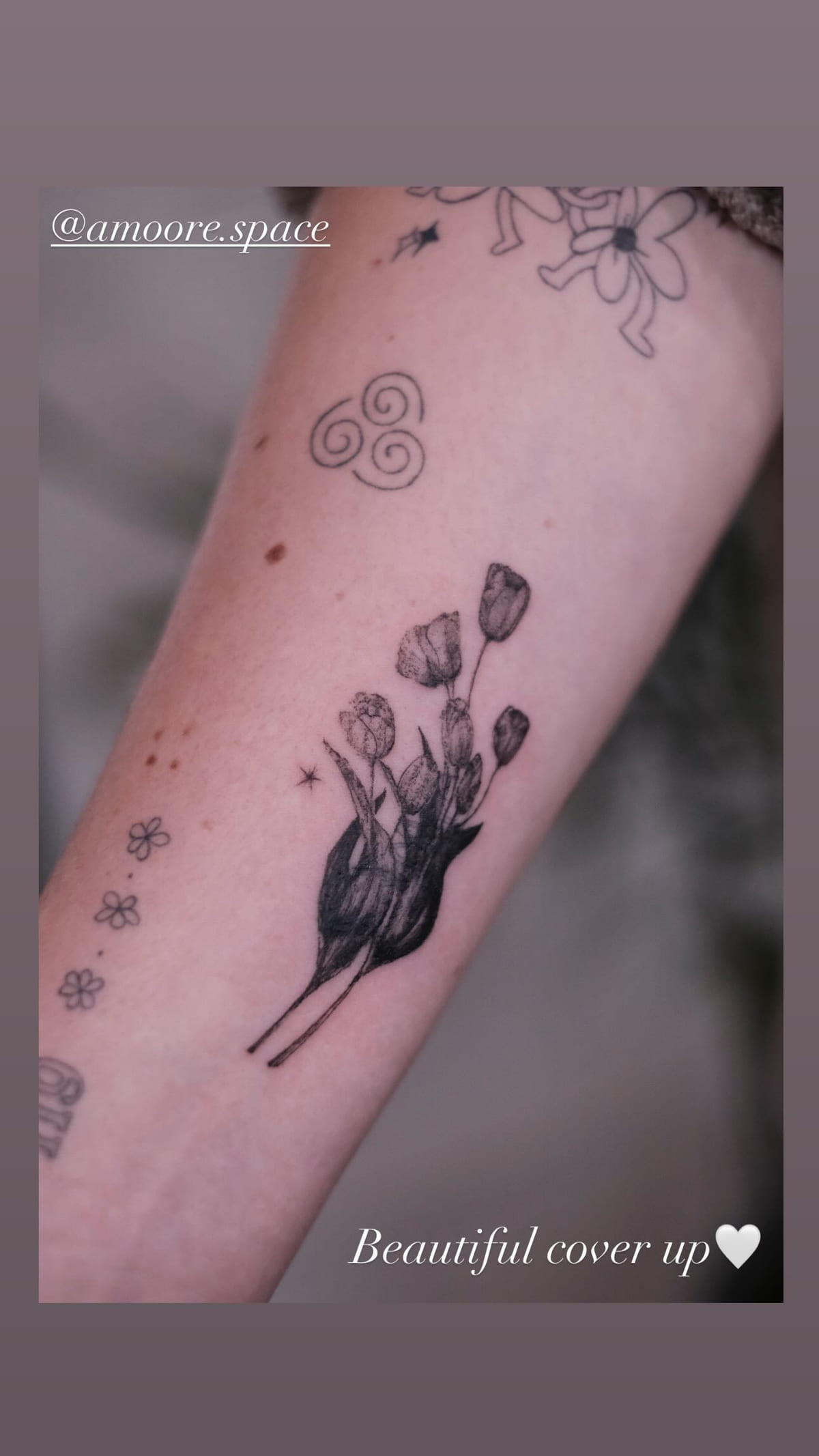 Solid black tulips on a forearm, healed fine line tattoo, the day it was made