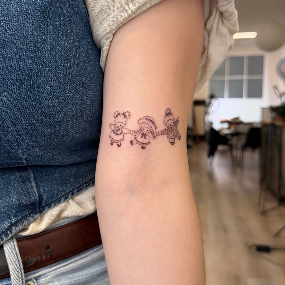 Three dressed bears holding hands, another view