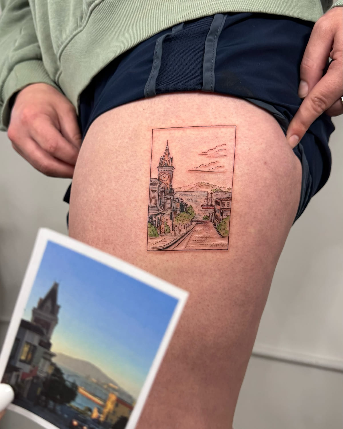 San Francisco street view in a rectangle with touches of color, fine line tattoo