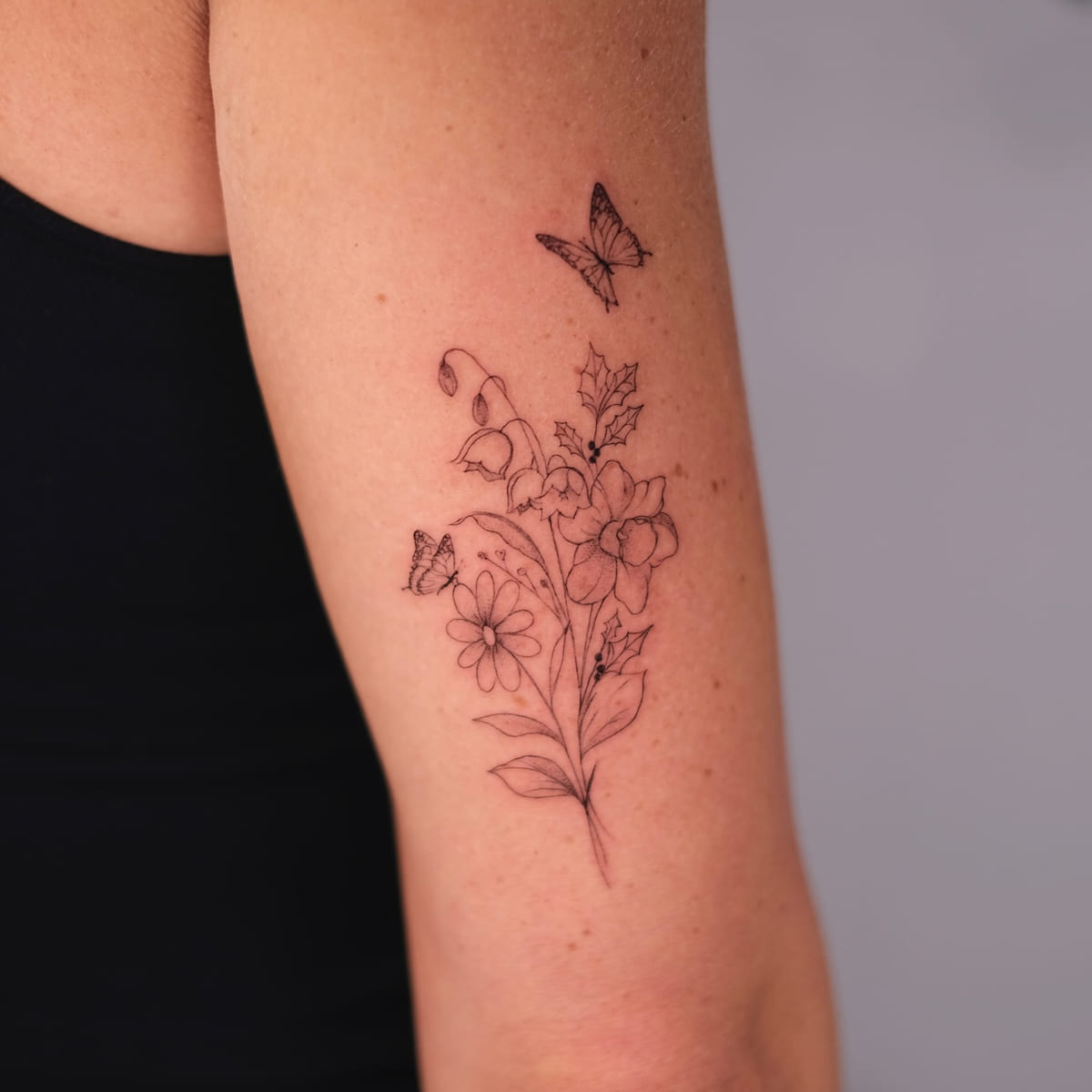 Tall bouquet with two butterflies, fine line tattoo
