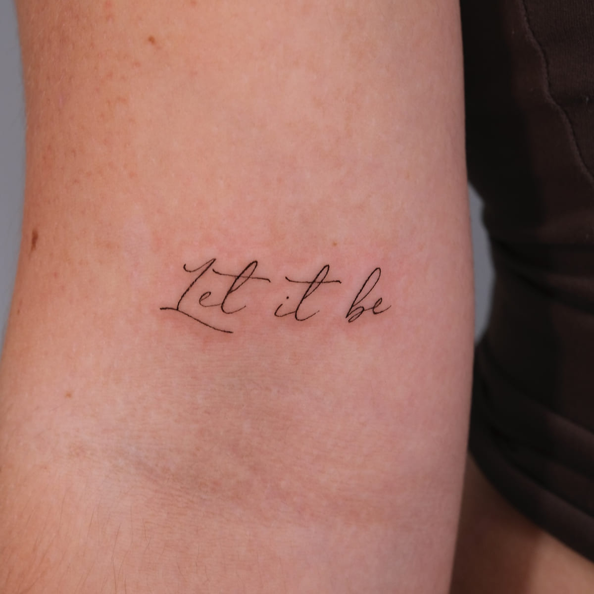 Script lettering: Let it be, fine line tattoo