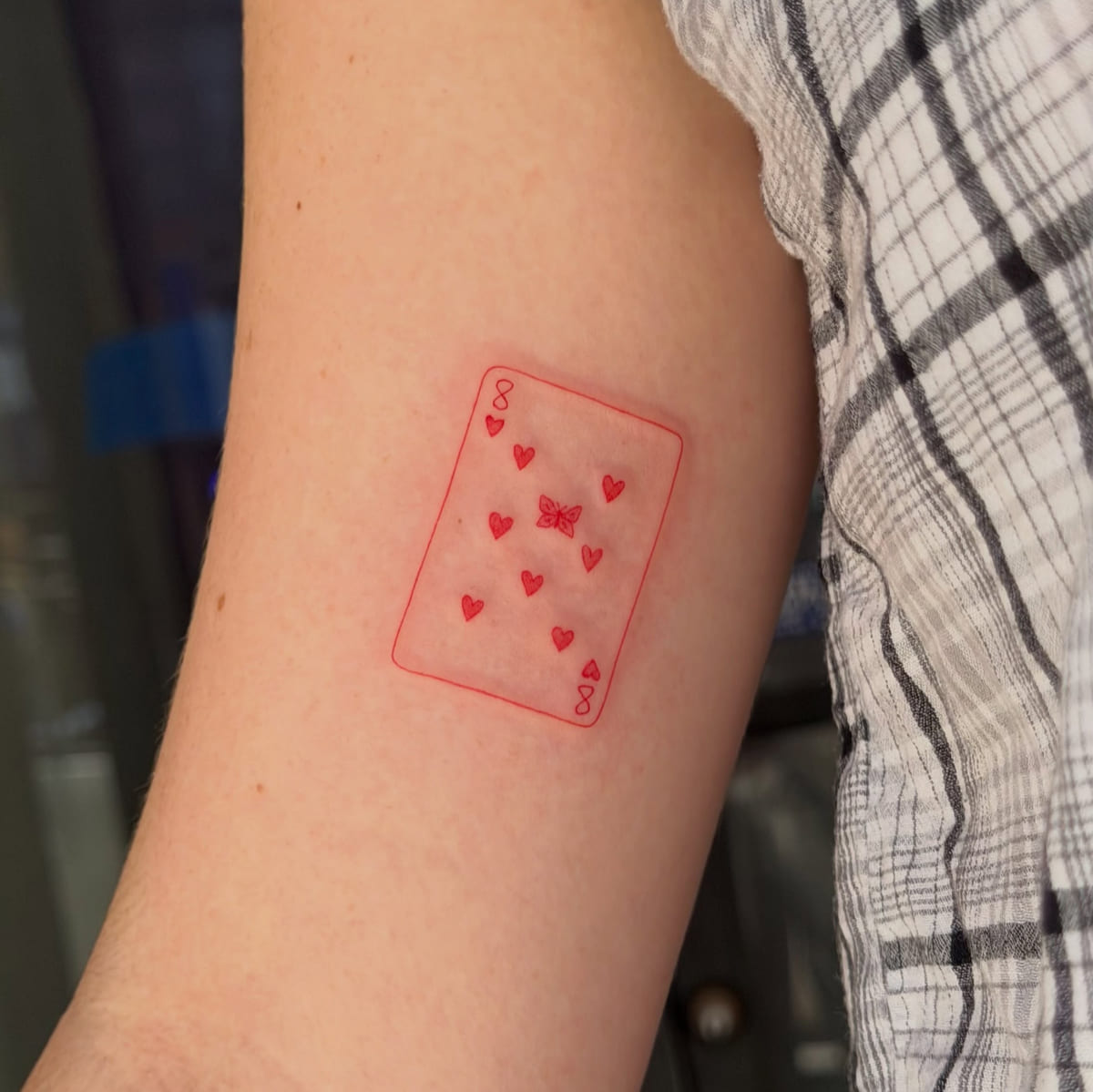 Playing card, eight of hearts with a butterfly, fine line tattoo