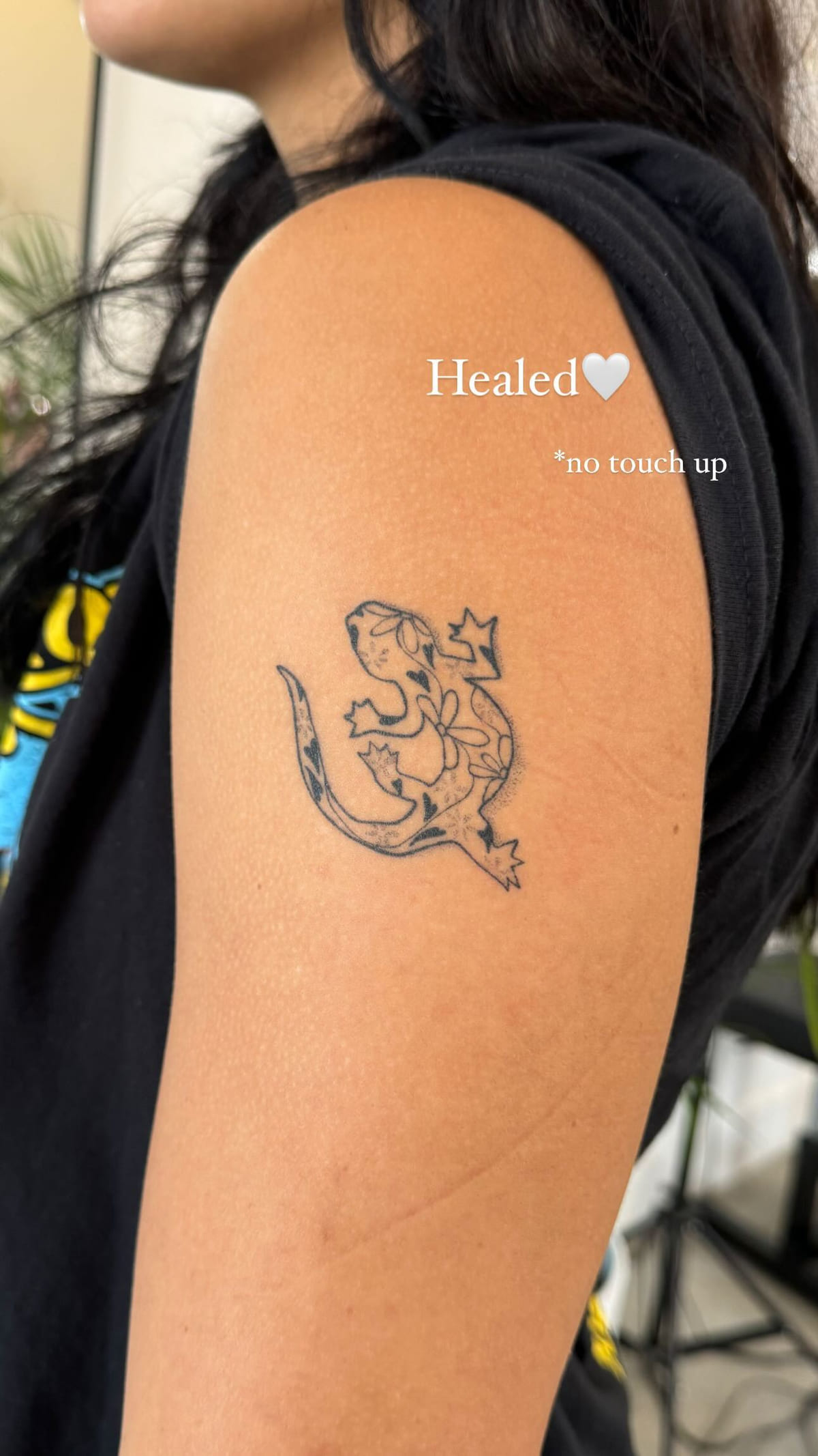 Flower filled gecko on a shoulder, healed fine line tattoo, healed